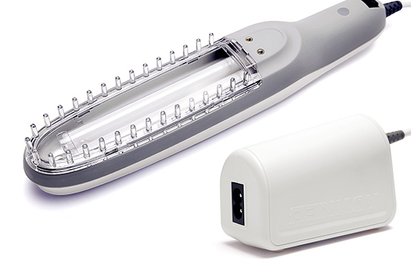 Applying phototherapy light to shoulder